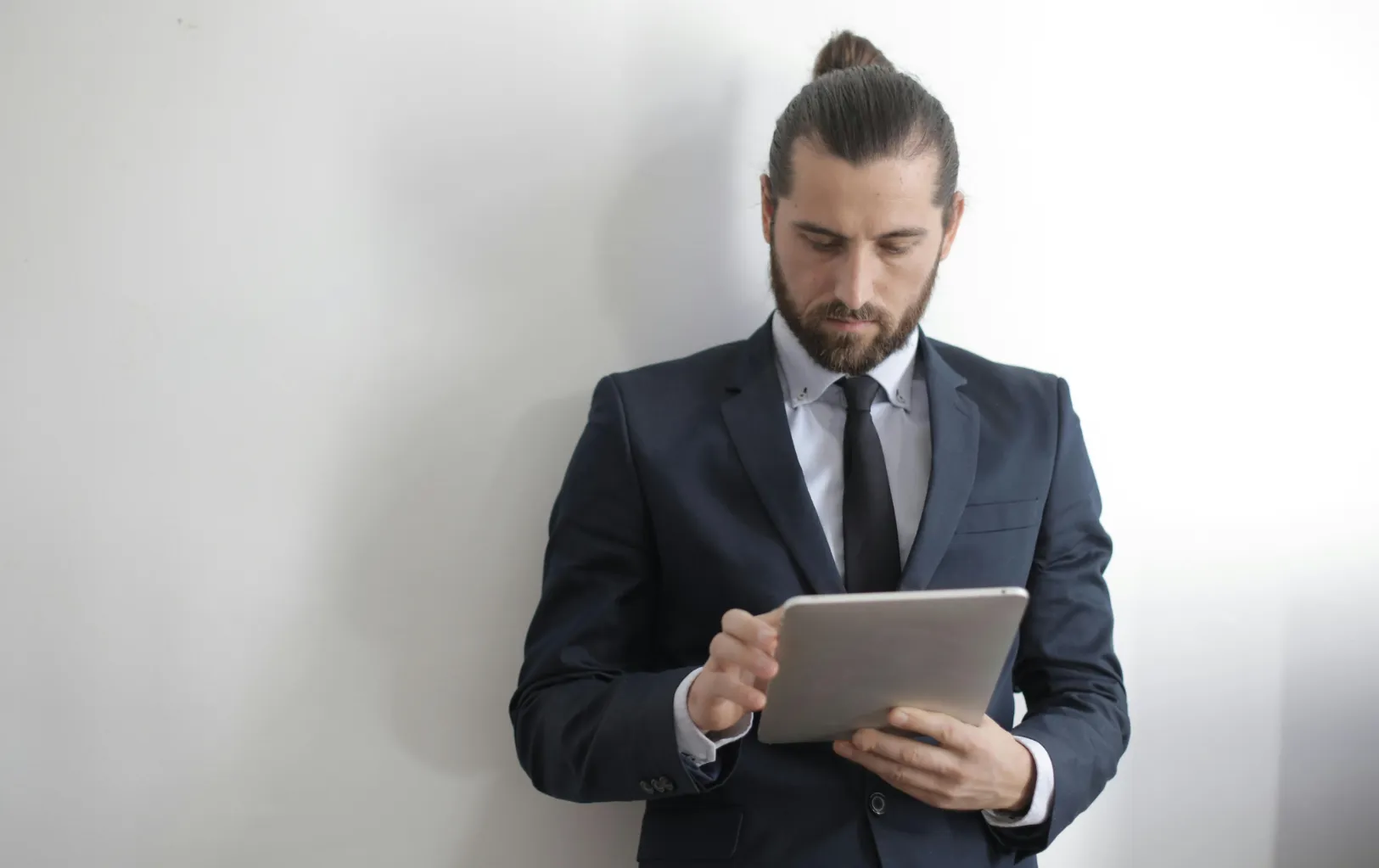 IT security expert analyzing data on a tablet